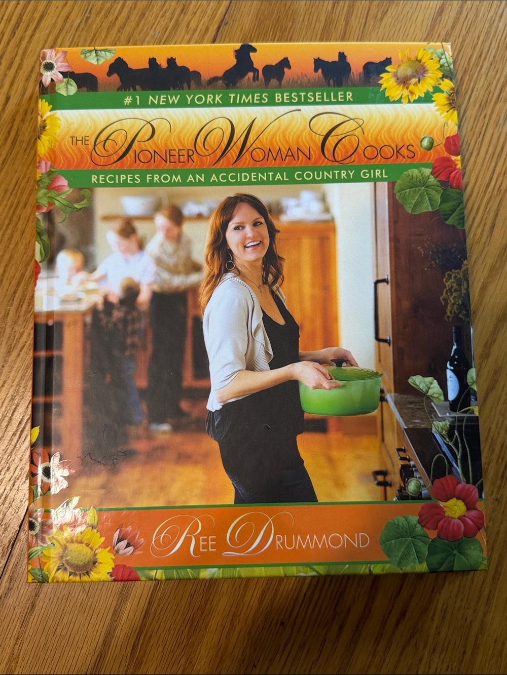The Pioneer Woman Cooks cookbook by Ree Drummond - Orange & Green cover